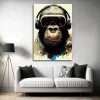 תמונת קנבס - קוף אומנותי עם אוזניות תמונה לבית למשרד לסלון וכל פינה שתבחרו